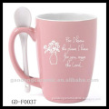 pink stoneware mug with spoon